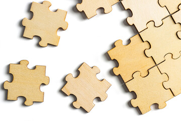 Incomplete wooden jigsaw puzzle with multiple puzzle pieces. concept of choices or options.