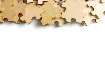blank empty white space with scattered wooden jigsaw puzzle as frame. empty space for copy spaces.