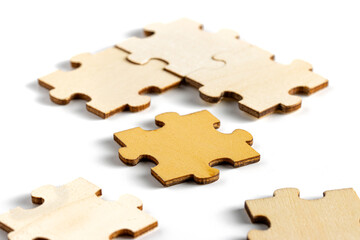 incomplete puzzle pieces, with seperated final pieces. Work and business concept with white background.