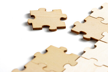 incomplete puzzle pieces, with seperated final pieces. Work and business concept with white...
