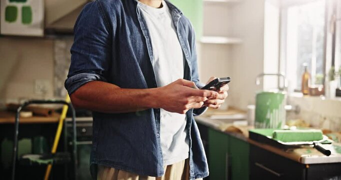Phone, hands and remodeling with man in kitchen for subcontractor research, project and paint idea. Home improvement, renovation and diy supplier contact with person in house for communication