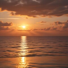 Fototapeta premium Golden Sunset Over Calm Ocean with Reflective Waves and Clouds