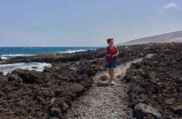 Walking trail across volcanic coast