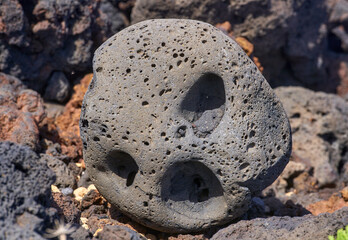 Lava rock with skull-like holes