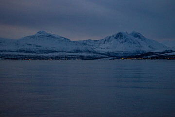 The calm shoreline of Telegrafbukta on southern Tromsøya, captured during Norway’s polar night.