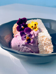 Cottage cheese casserole with blueberry yogurt and edible flowers

