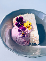 Cottage cheese casserole with blueberry yogurt and edible flowers
