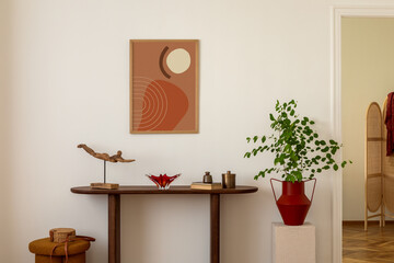 Cozy and stylish interior of living room with mock up poster frame, wooden console, flowers in...