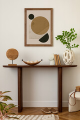 Stylish and minimalist composition on wooden design commode with mock up poster frame, flowers in...