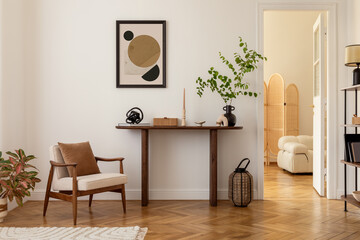 Cozy and stylish interior of living room with mock up poster frame, wooden console, flowers in...