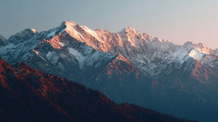 Majestic Mountain at Dawn: Capturing the breathtaking beauty of a snow-capped mountain range at dawn, the scene evokes a sense of serenity and the awe-inspiring power of nature.