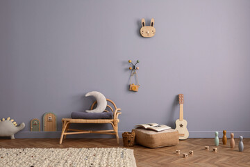 Child living room interior with blue wall, rattan bench, plush whale, mouse, toys, guitar, ornament on wall, braided rug and personal accessories. Home decor. Template. © FollowTheFlow