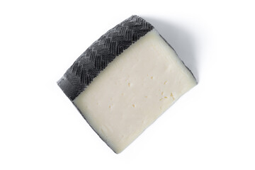 Close-up of a wedge of semi-cured cow's cheese isolated on white background