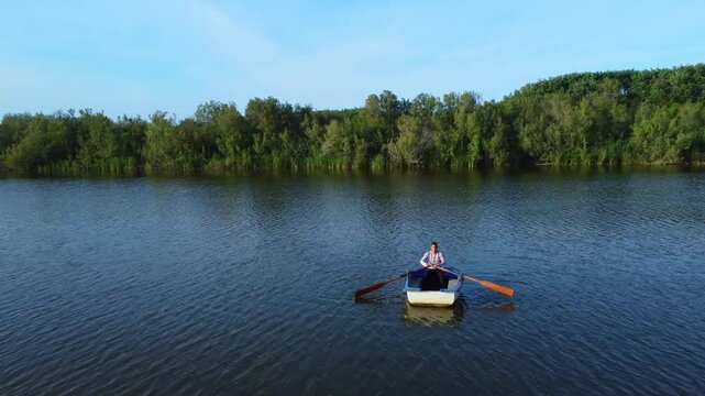 fisherman in boat get fishing nets from river, Silhouette of fisherman,a dip net for fishing at Pakpra village, jijel Algeria. fishing boat traditional and net . Fisherman on the traditional boat.
