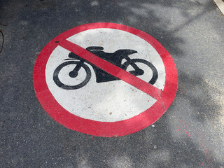 On the road there is a sign "No motorcycles allowed". A zone where parking is prohibited.