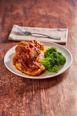 chipotle sauced pork chops with steamed broccoli