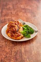 chipotle sauced pork chops with steamed broccoli