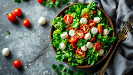 Fresh salad with lettuce, tomatoes and mozzarella cheese. 