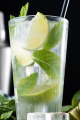 Classic Mojito Cocktail with Lime and Mint on black background