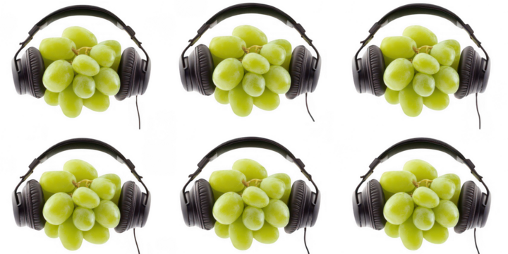Grapes wearing listening devices set on transparent background