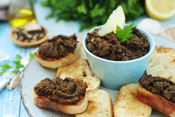 A bowl with tapenade - traditional olive dip in Mediterranean region	