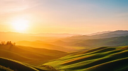 Serene sunset over rolling green hills with distant mountains and soft clouds in the sky