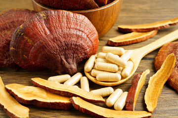 Lingzhi or Reishi mushroom with capsules, organic natural healthy food.