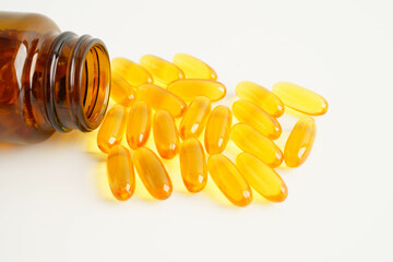 Fish oil or Cod liver oil gel in capsules with omega 3 vitamins, supplementary healthy food.