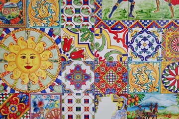 Colorful collection of traditional Sicilian ceramic tile patterns with floral, sun, and folkloric motifs, rich in detail and vibrant in color.