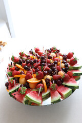 A variety of fruits on a sweet buffet table.