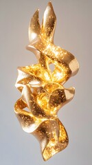 A golden, textured sculpture with flowing forms.