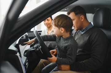 family choosing a car in dealership, they want the most comfortable and safe car