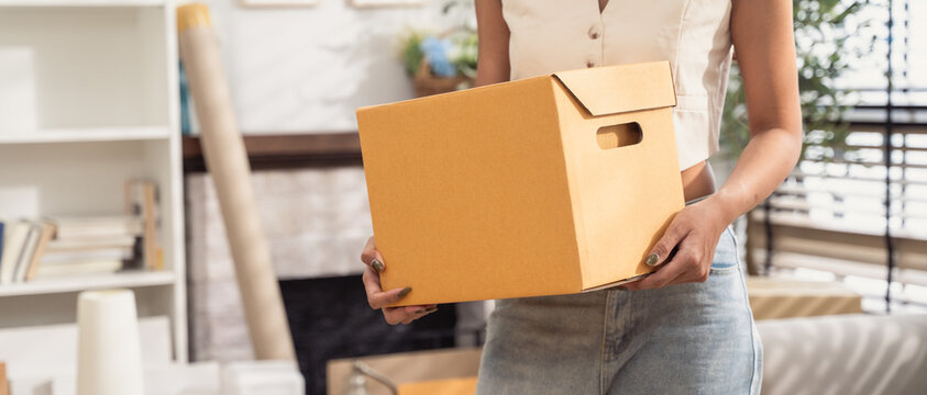 Background of people holding cardboard box for moving house. Ready to move concept. new home, life change