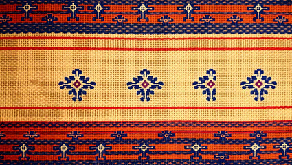 Intricate Textile Artistry: Captivating the beauty of traditional textile craftsmanship, this close-up shot unveils a tapestry of rich colors and intricate patterns.