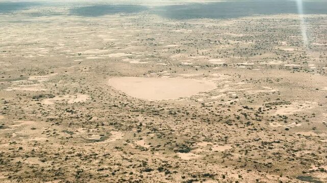 Witness the rare and beautiful sight of Lake Eyre filling with water in the South Australian outback. This aerial perspective is perfect for showcasing unique natural landscapes and remote beauty.