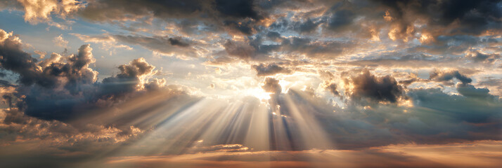 Beautiful sky at sunrise with clouds and sun. Heavenly light rays breaking through clouds. Divinity light. Easter morning. Biblical scene, heaven, sign from God. Resurrection and ascension of Christ