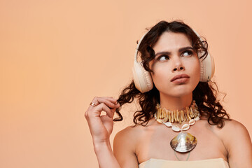 Stylish young woman enjoys summer vibes with headphones and creative accessories