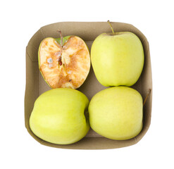 Spoiled apple and good ones in box isolated on white, top view