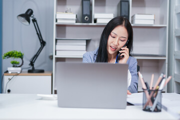 Accountant woman working on financial investment on calculator, calculation, business growth analysis and marketing on graph at office.