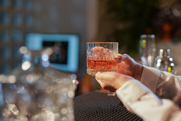 Professional female bartender preparing alcoholic drinks in a bar