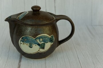Handcrafted Ceramic Teapot with Puffer Fish Illustration on Side