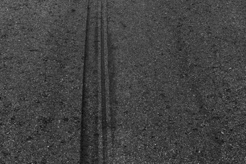 Abstract asphalt street road background with black tire marks on race track, Texture and background car automobile and automotive skid tire marks.