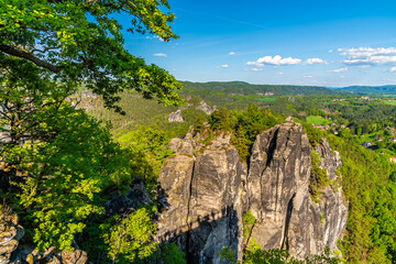 A view towards sandstone rock formations from the Bastei vantage point in Saxon Switzerland, Germany in springtime