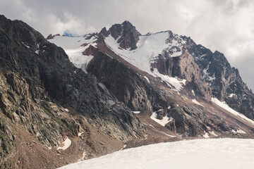 Highlands where mountains with rocks and glaciers. Zailiysky Alatau ridge in the Tien Shan mountain system in Kazakhstan in the city of Almaty views from the Talgar Pass