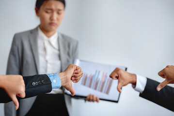 Teamwork meeting showing thumb down to woman presentation speaker in meeting room. audience show...