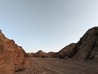 Jordan Trail long distance hiking from Dana Valley to Petra and Wadi Rum.Wadi Rum Desert, Jordan. The red desert and Jabal Al Qattar mountains,Arabia