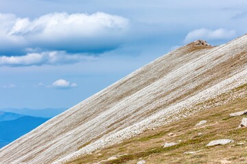 Mountain slope covered in white flora
