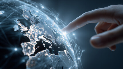 Globalization and Digital Transformation Concept: A person's hand interacting with a digital model of the Earth, representing a globalized world.