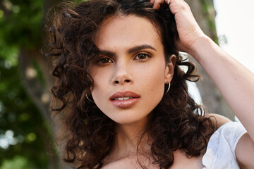 Radiating summer vibes with effortless style and natural beauty in a lush outdoor setting