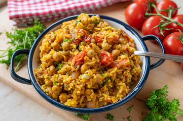 Healthy  chickpea curry with vegetables and basmati rice. Beautiful vegan food background